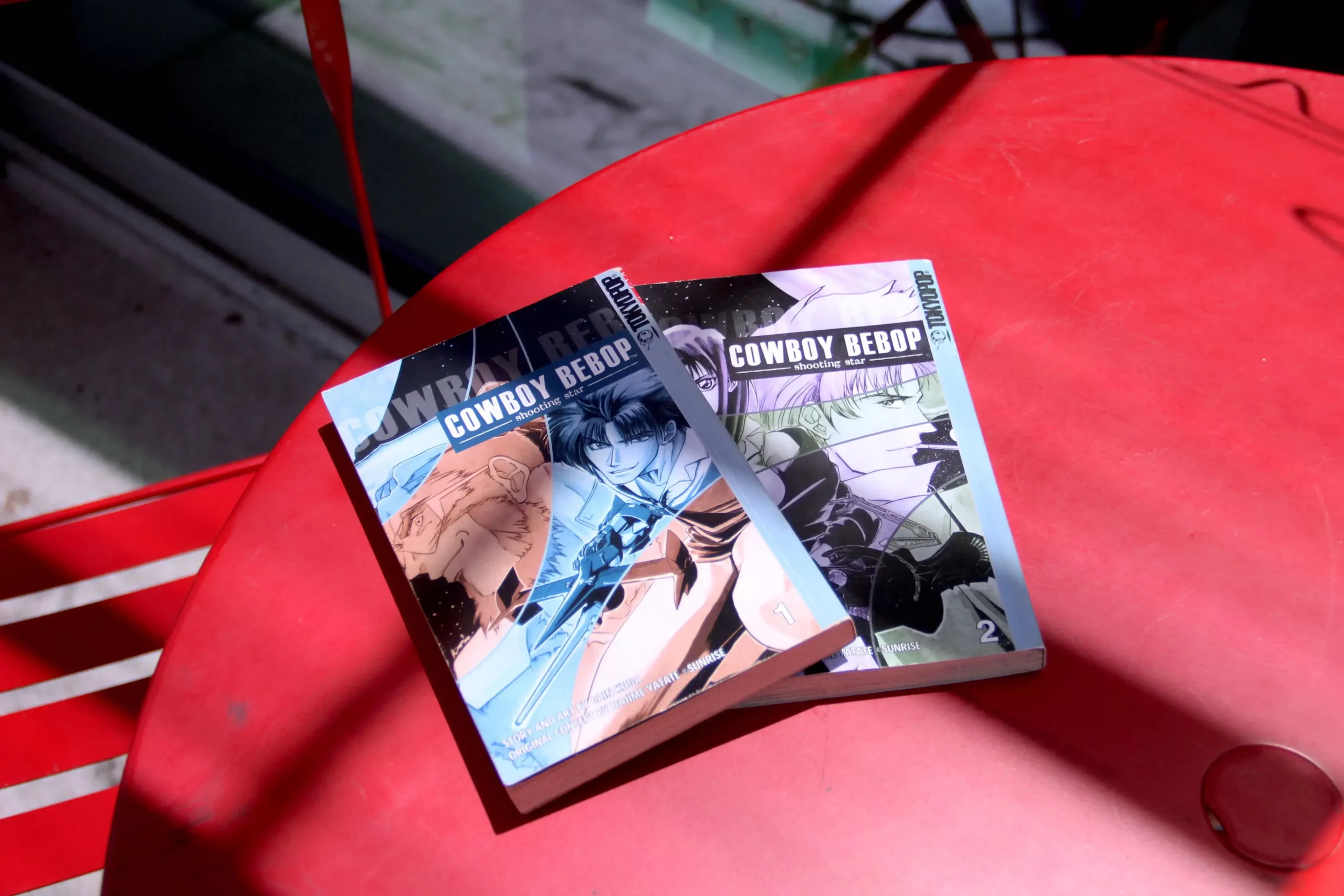 cowboy bebop shooting star two paperback volumes on table