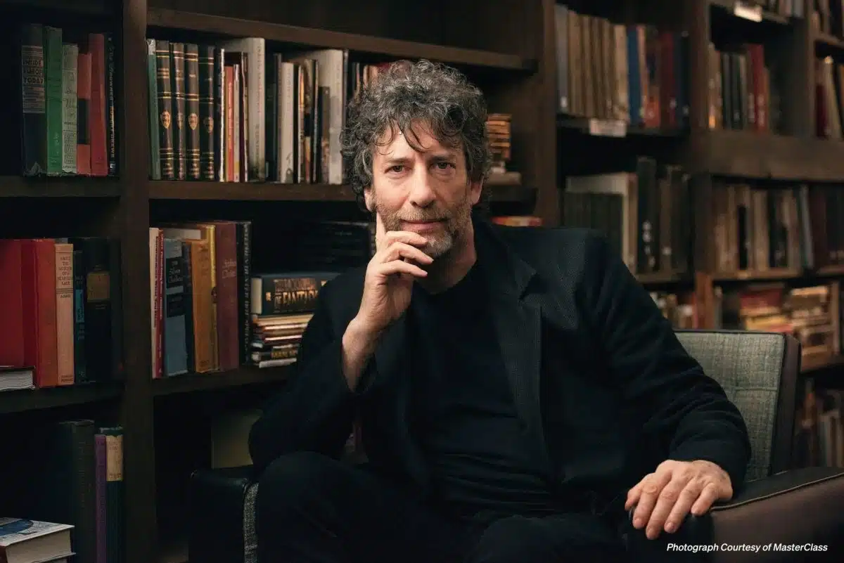Neil Gaiman Sitting in a Library
