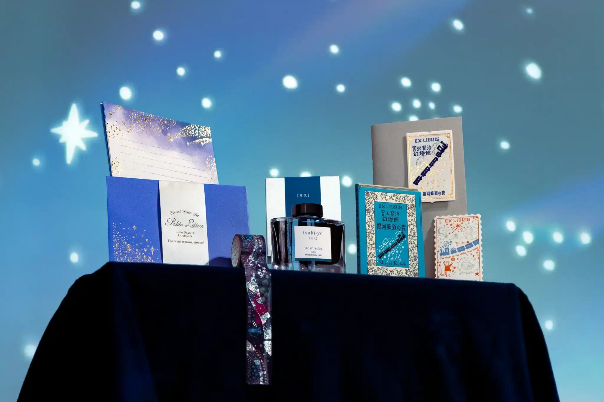 An Assortment of Stationery Products With a Starry Background
