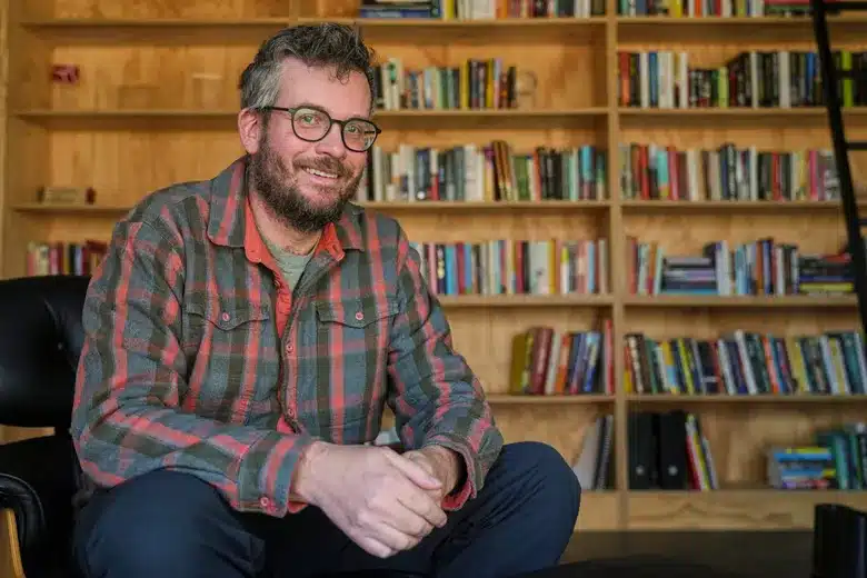 John Green Sitting and Smiling John Green Sitting and Smiling
